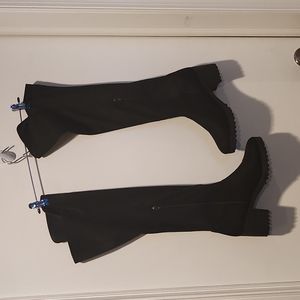 Black knee high heeled boots